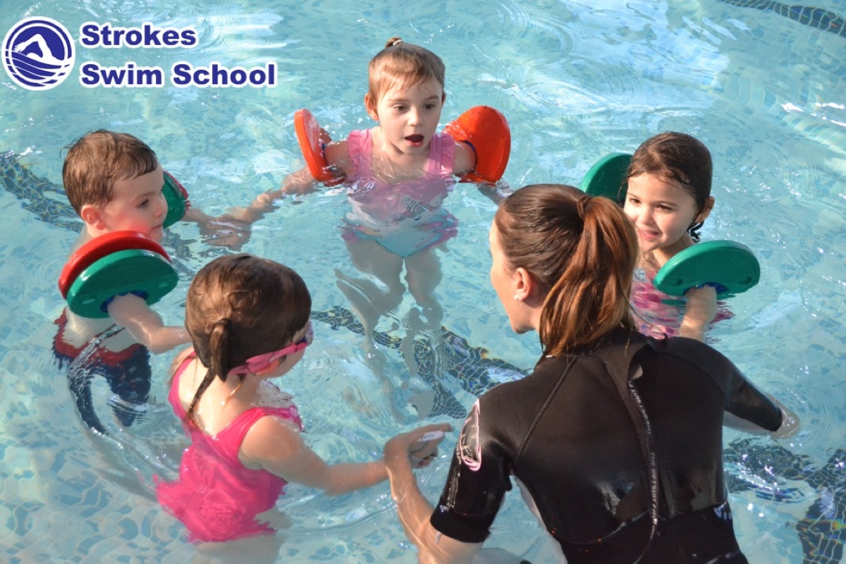 Children's group swimming lesson with instructor at Sweyne School Essex